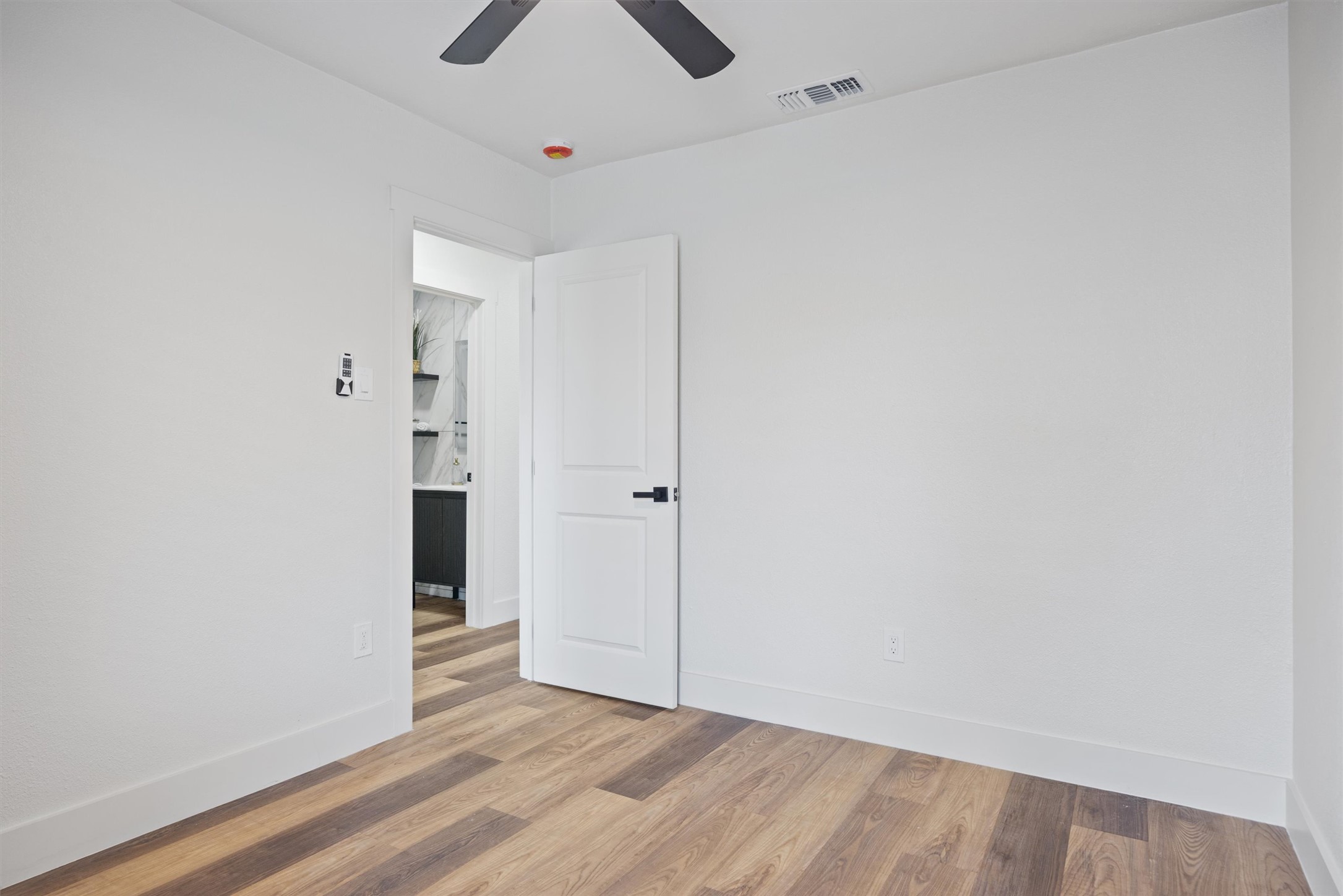 6212 Boxcar Run Austin, TX 78745 - Photo 27 of 36 Spare room featuring wood finished floors and ceiling fan