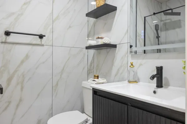 a bathroom with a sink and a mirror