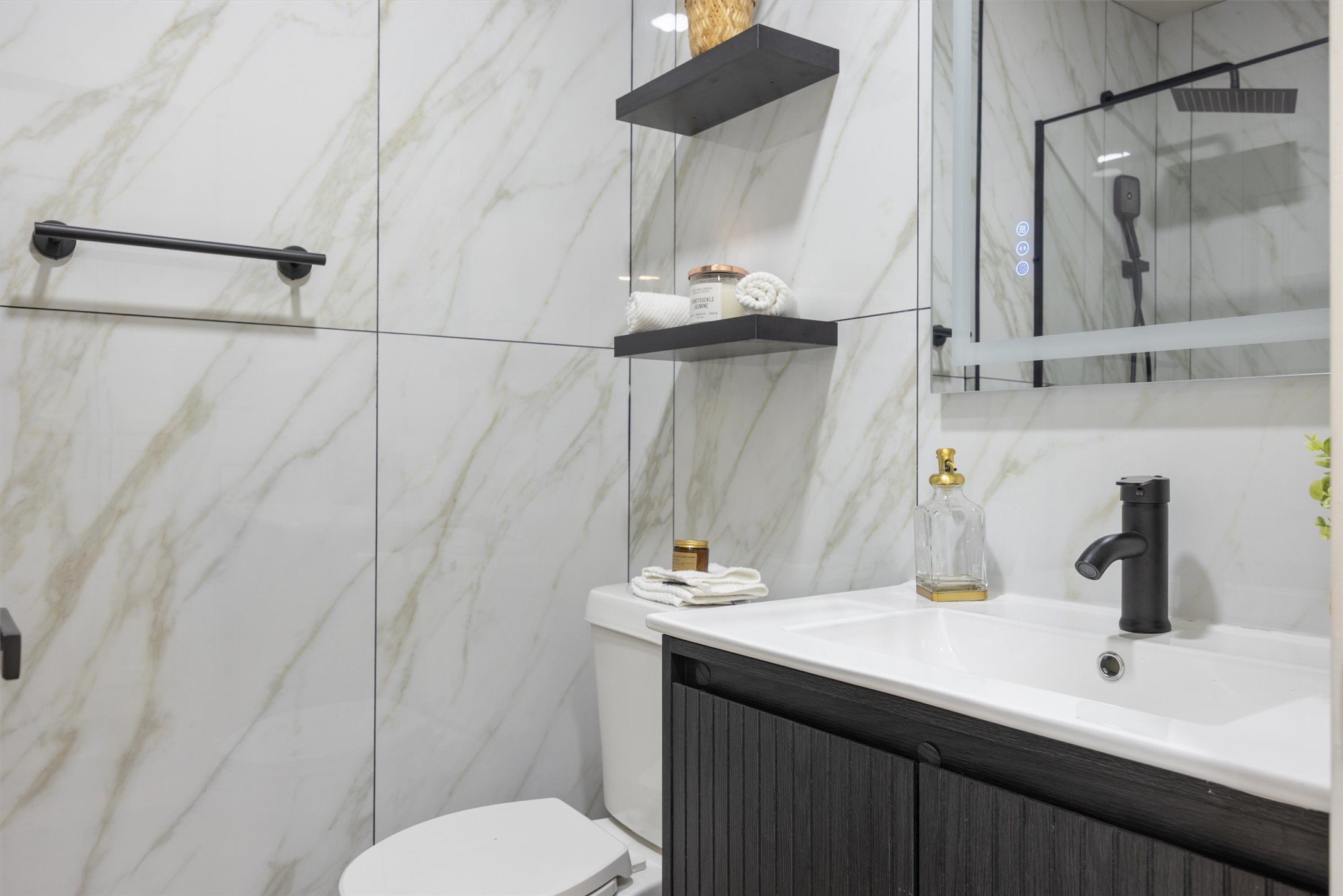 6212 Boxcar Run Austin, TX 78745 - Photo 28 of 36 Full bath featuring vanity, a marble finish shower, and tile walls