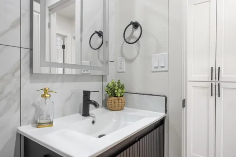a bathroom with a sink and a mirror
