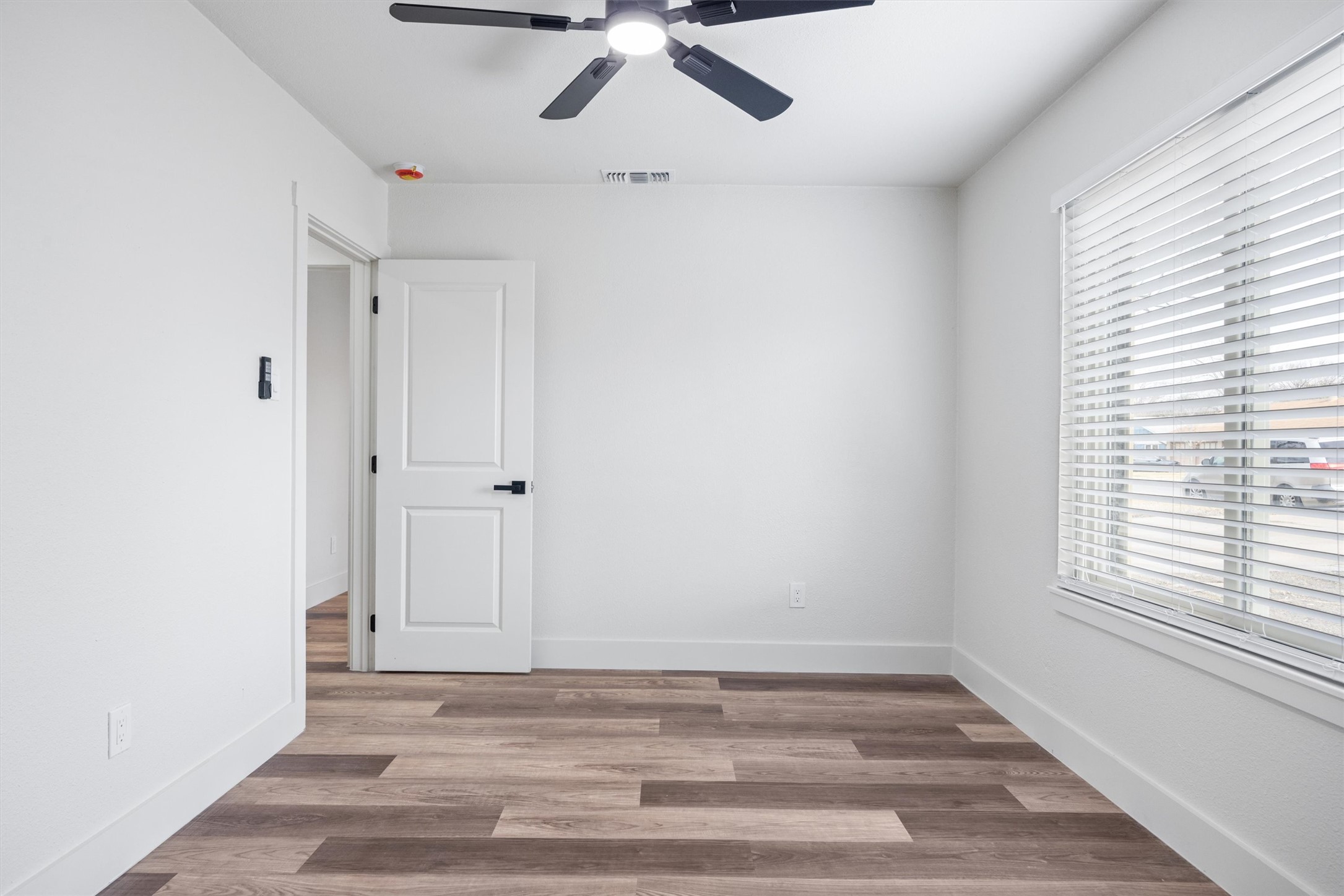 6212 Boxcar Run Austin, TX 78745 - Photo 33 of 36 Empty room featuring light wood-type flooring and a ceiling fan