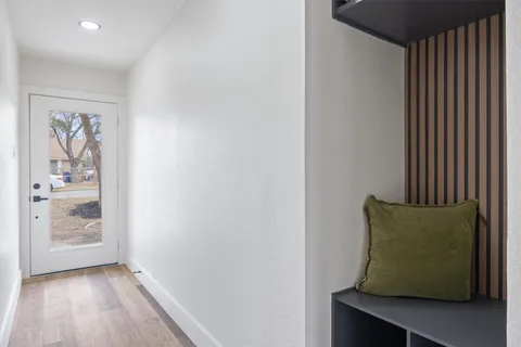 a room with a window and wooden floor