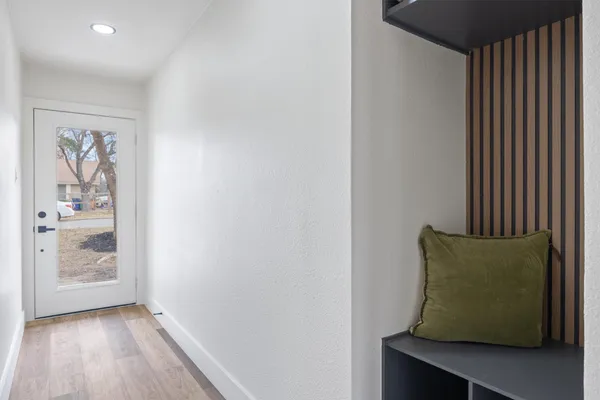 a room with a window and wooden floor