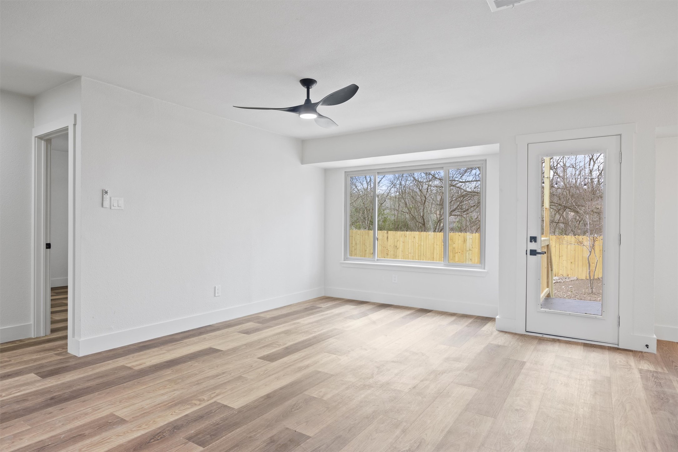 6212 Boxcar Run Austin, TX 78745 - Photo 6 of 36 Empty room featuring light wood finished floors and ceiling fan