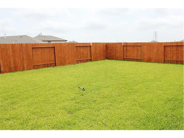 a view of an ocean view and with backyard space