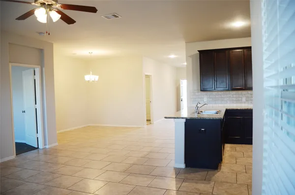 a large kitchen with kitchen island a sink stainless steel appliances and cabinets
