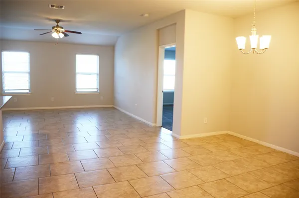 a view of a kitchen with a sink and a refrigerator