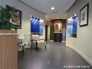 a lobby with furniture and painted walls