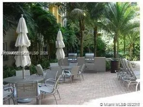 a view of a patio with a table and chairs
