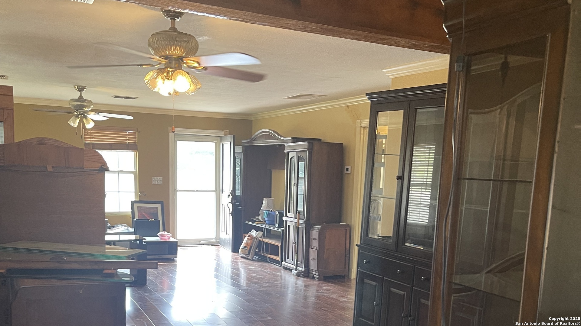 6932 Green Valley Road Cibolo, TX 78108 - Photo 11 of 18 a view of a dining room with furniture window and wooden floor