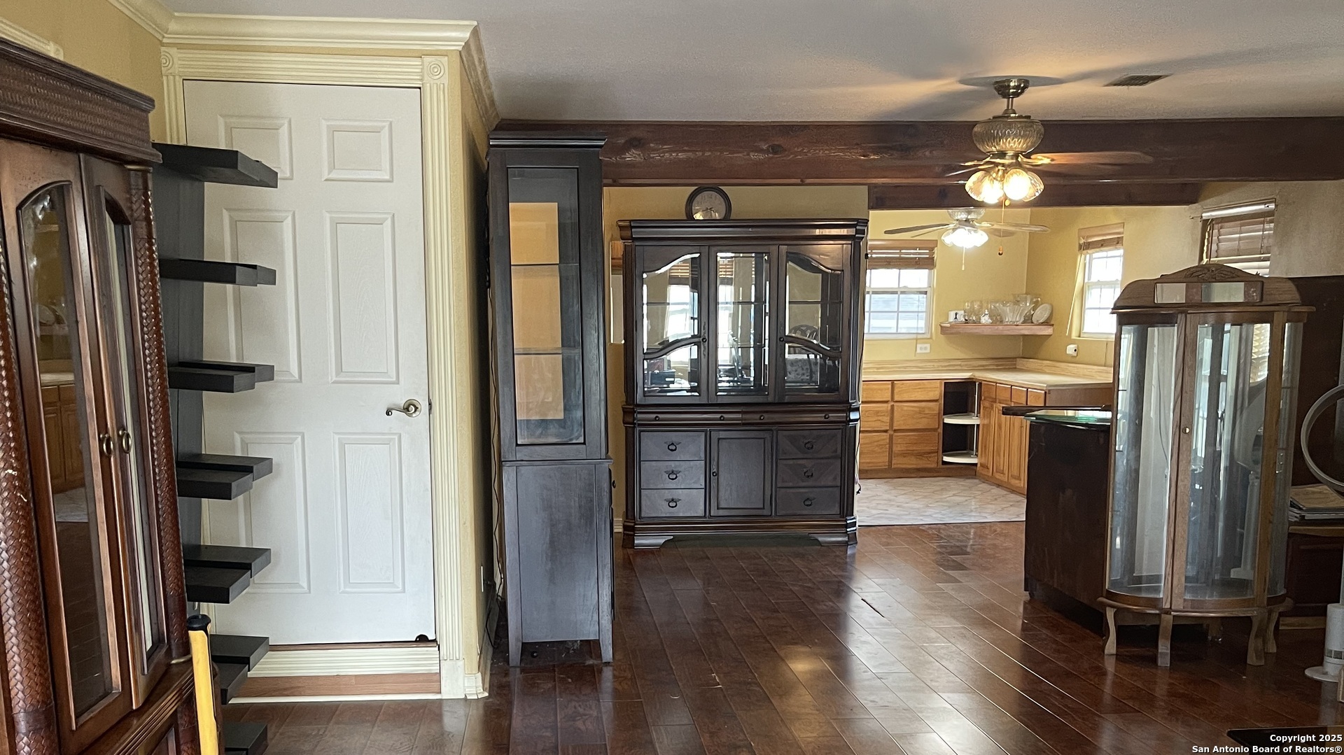 6932 Green Valley Road Cibolo, TX 78108 - Photo 13 of 18 a view of a kitchen with stainless steel appliances refrigerator stove and wooden floor