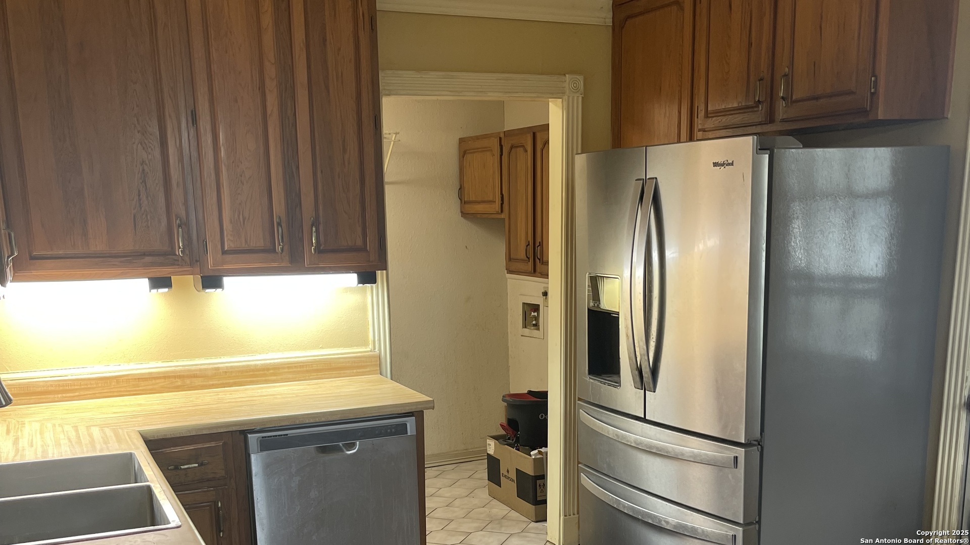 6932 Green Valley Road Cibolo, TX 78108 - Photo 10 of 18 a kitchen with stainless steel appliances a refrigerator and cabinets