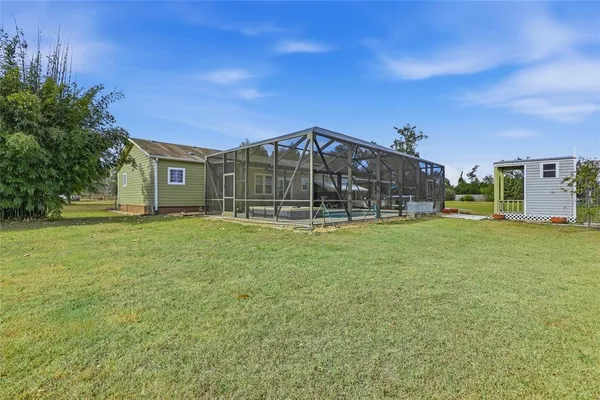a view of a house with a big yard