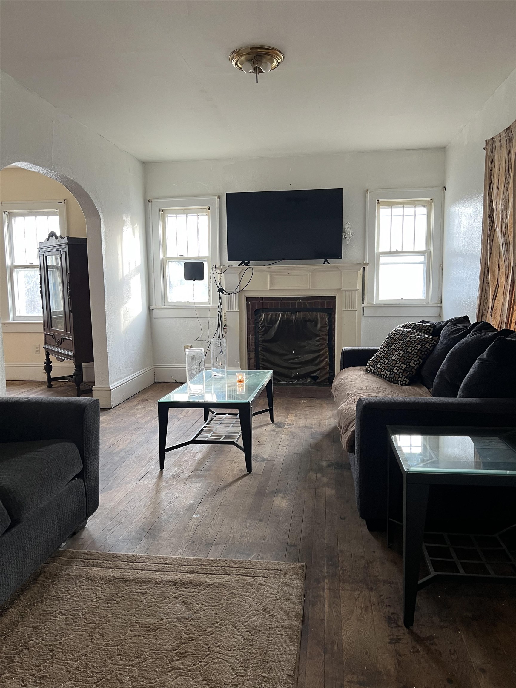 220 Elizabeth Avenue Waynesboro, VA 22980 - Photo 7 of 16 a living room with furniture and a fireplace