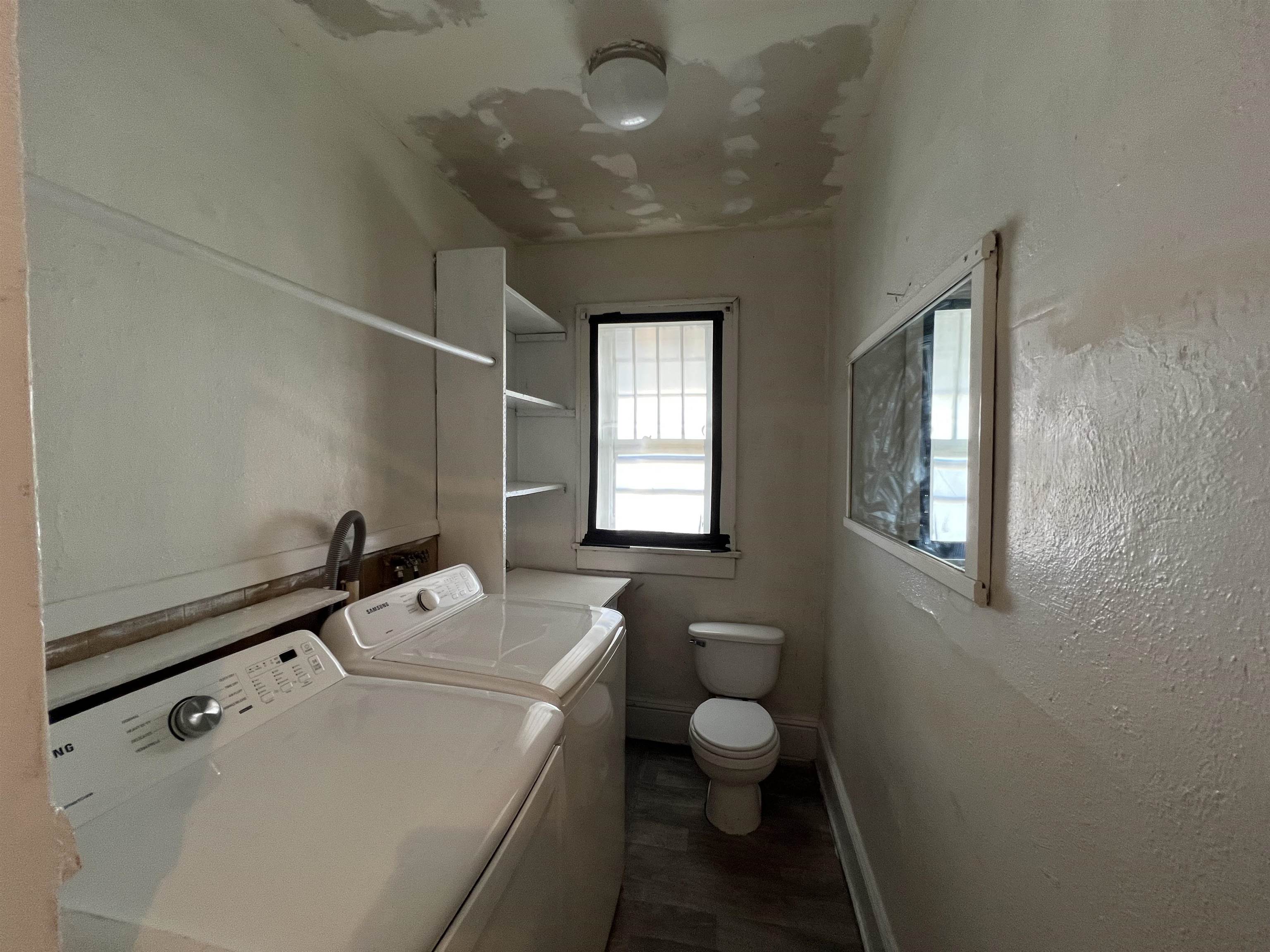 220 Elizabeth Avenue Waynesboro, VA 22980 - Photo 10 of 16 a bathroom with a sink a toilet and window
