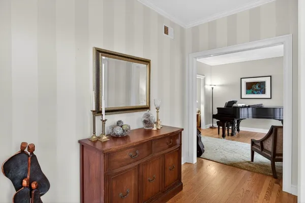 a living room with furniture windows and a flat screen tv