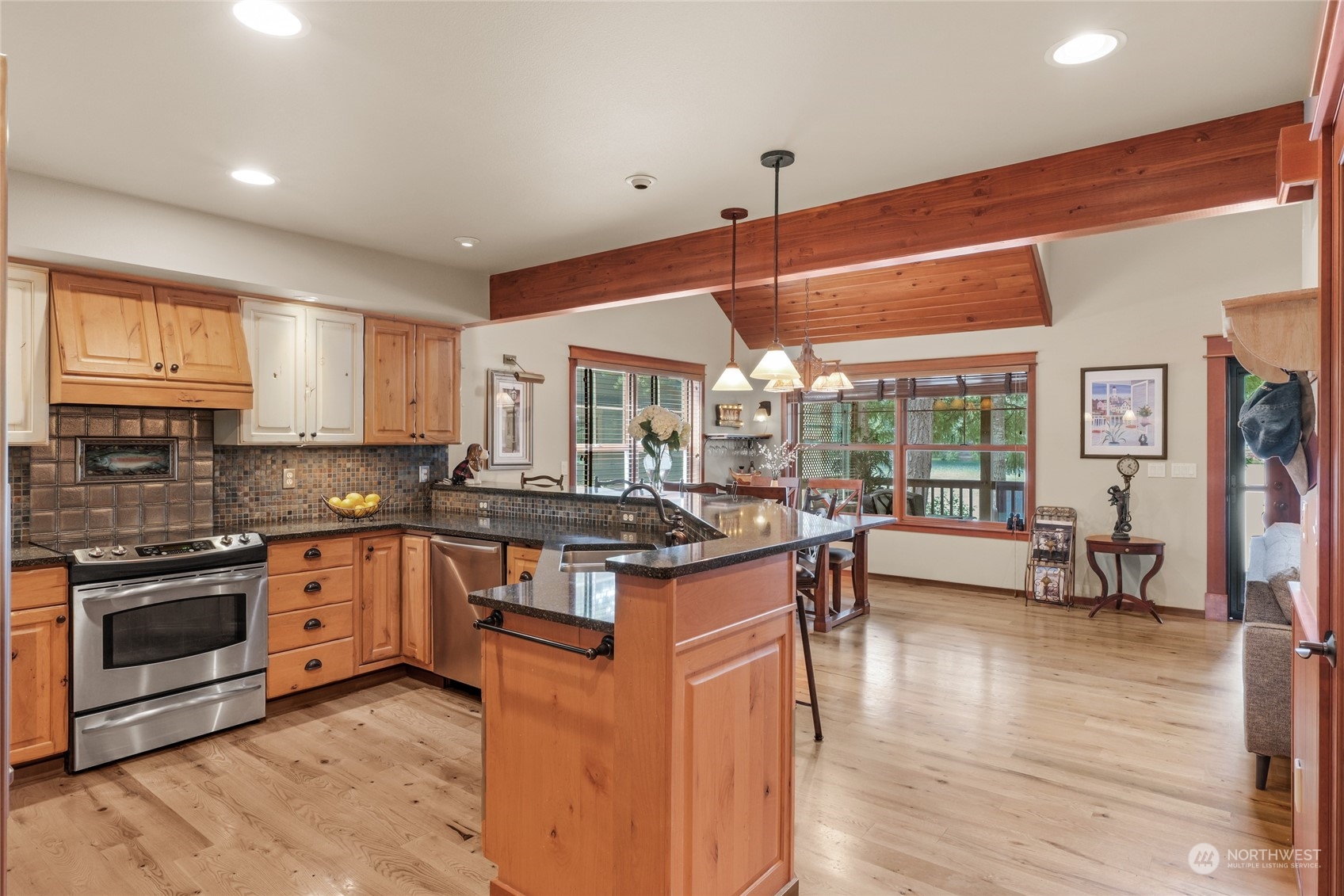 160 East Benson Lake Road Grapeview, WA 98546 - Photo 13 of 34 a kitchen with stainless steel appliances granite countertop a stove and a sink