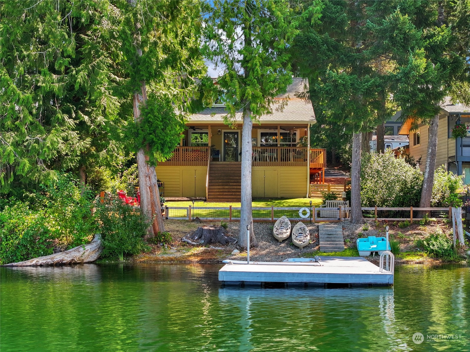 160 East Benson Lake Road Grapeview, WA 98546 - Photo 2 of 34 a view of a house with pool and chairs