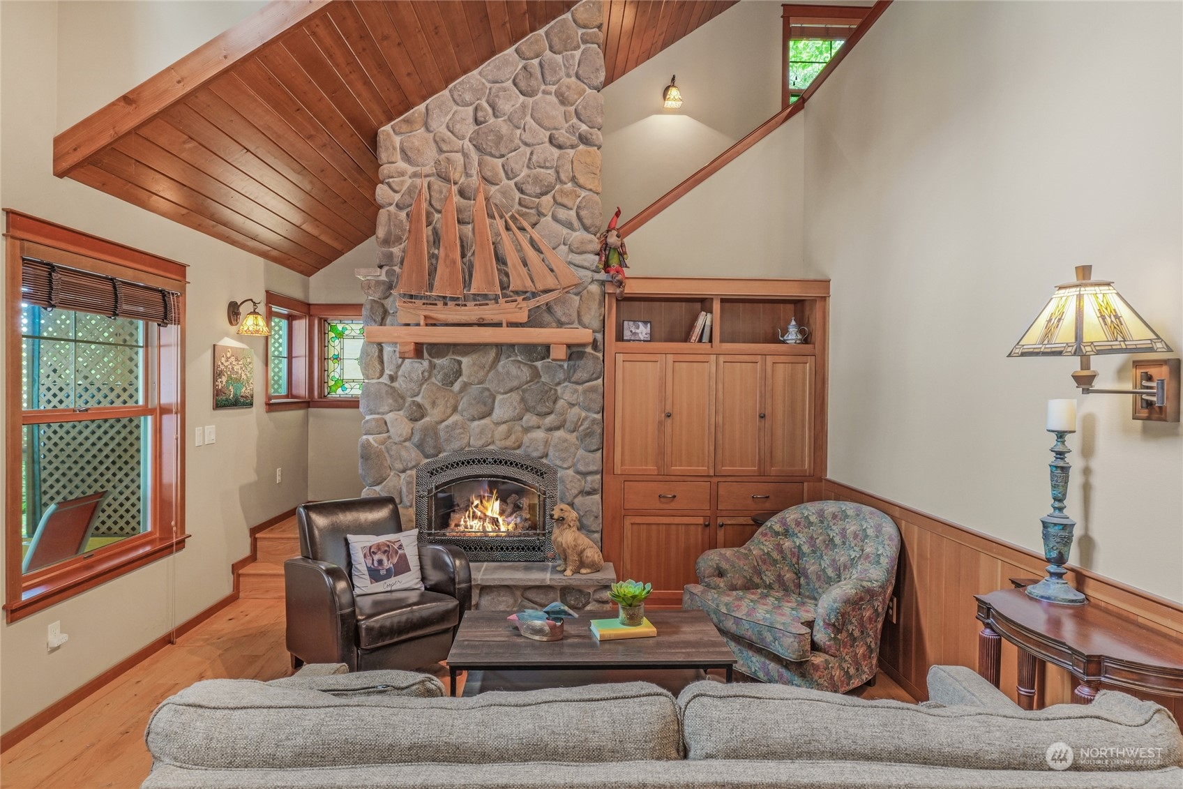 160 East Benson Lake Road Grapeview, WA 98546 - Photo 21 of 34 a living room with furniture and a fireplace