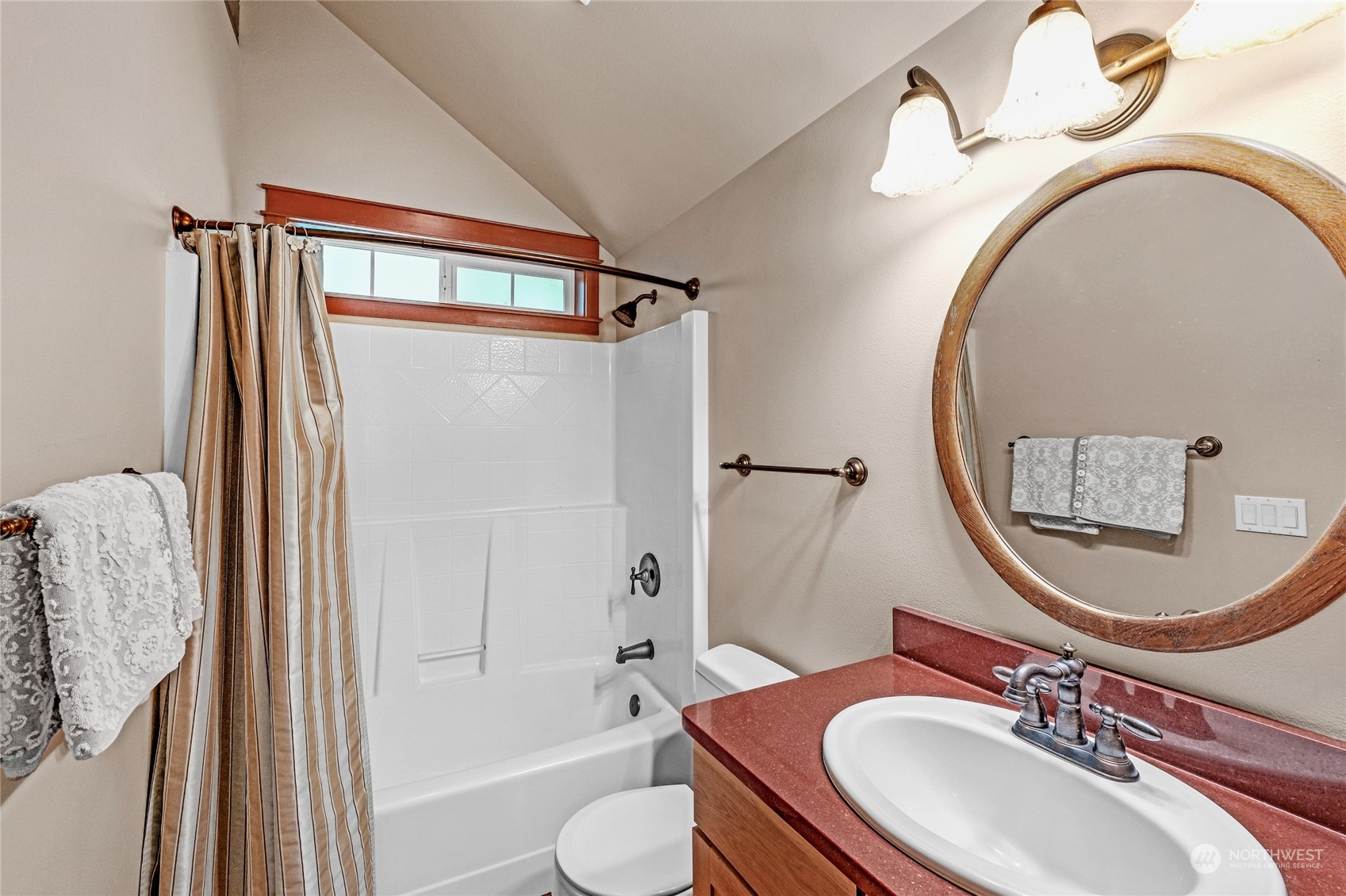 160 East Benson Lake Road Grapeview, WA 98546 - Photo 23 of 34 a bathroom with a sink a mirror a toilet and a mirror
