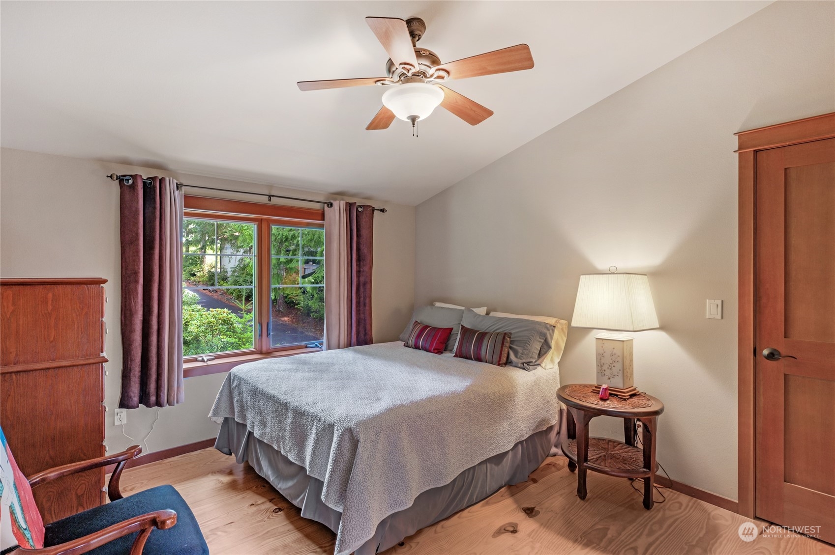 160 East Benson Lake Road Grapeview, WA 98546 - Photo 24 of 34 a bedroom with a bed and a window