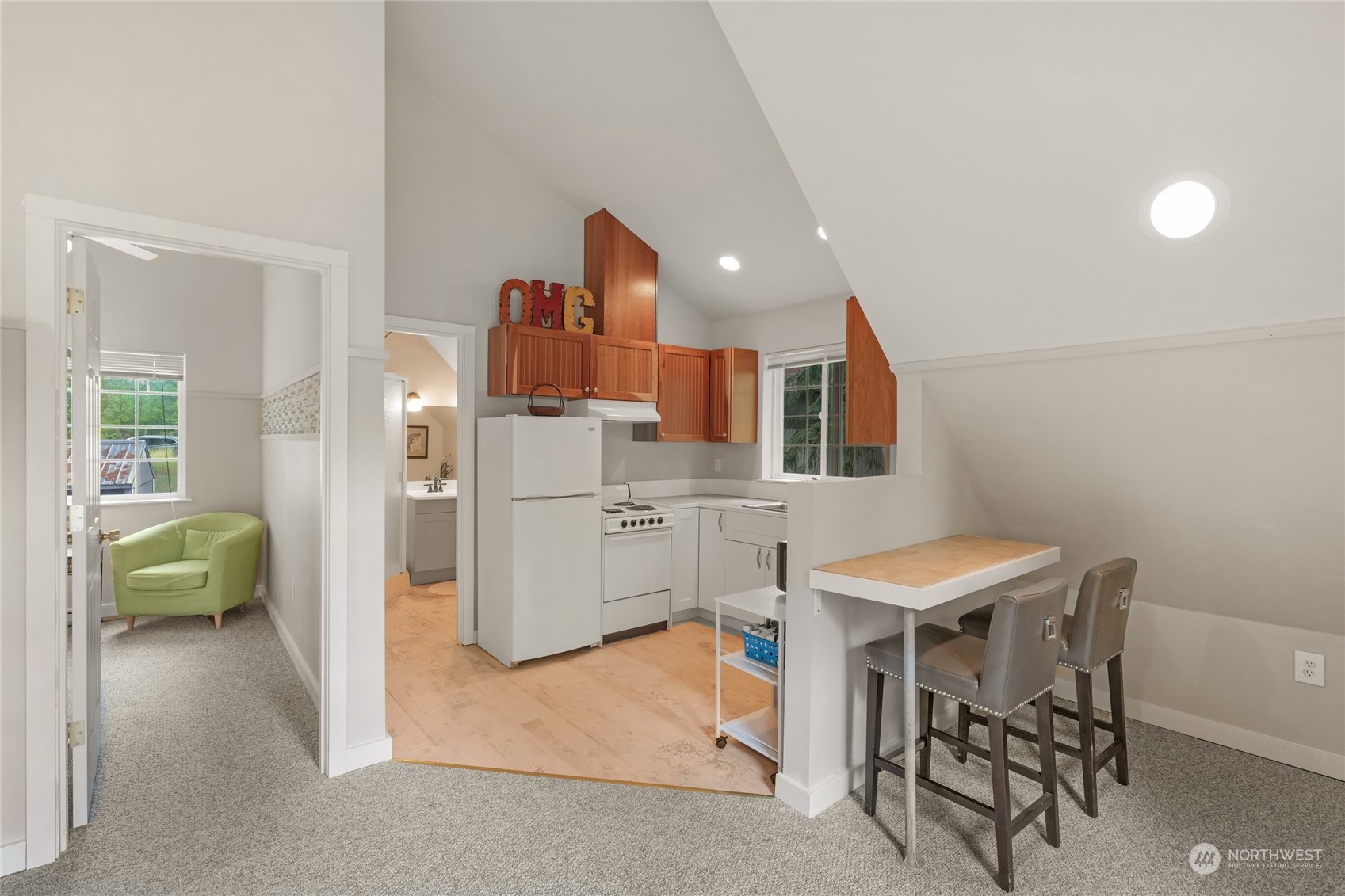 160 East Benson Lake Road Grapeview, WA 98546 - Photo 30 of 34 a room with furniture a air conditioner and a table