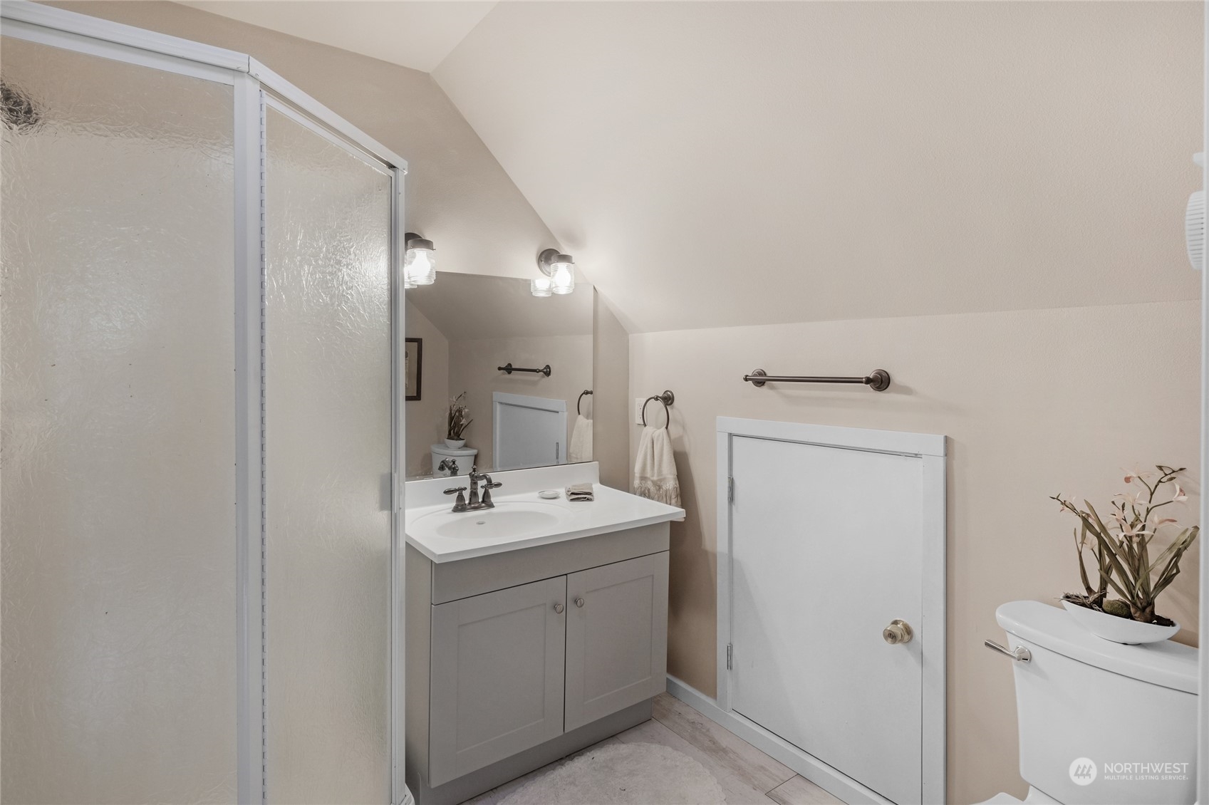 160 East Benson Lake Road Grapeview, WA 98546 - Photo 32 of 34 a bathroom with a sink a toilet and a mirror