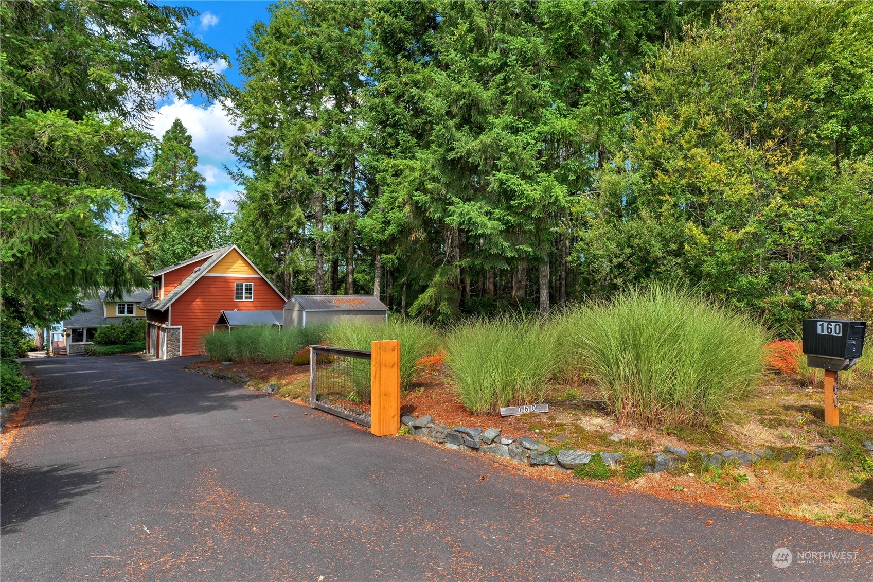 160 East Benson Lake Road Grapeview, WA 98546 - Photo 4 of 34 a backyard of a house with lots of green space