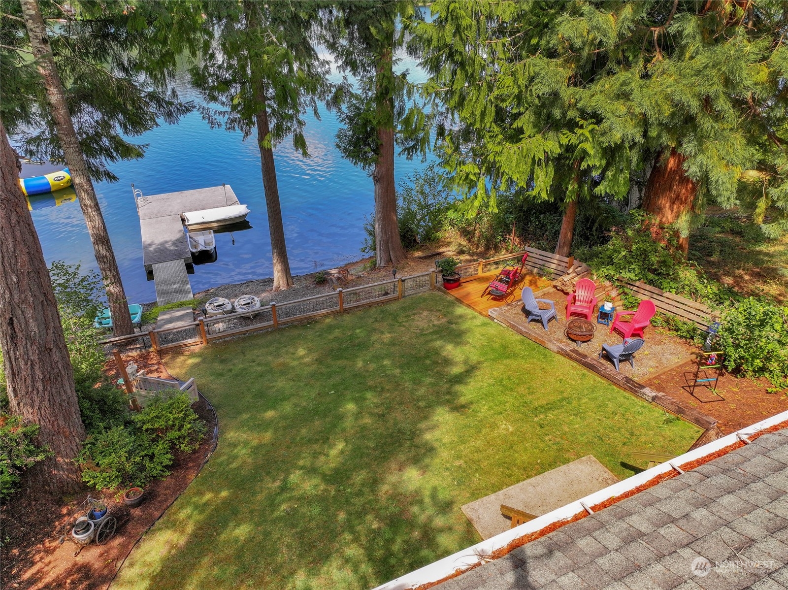 160 East Benson Lake Road Grapeview, WA 98546 - Photo 5 of 34 a backyard of a house with table and chairs