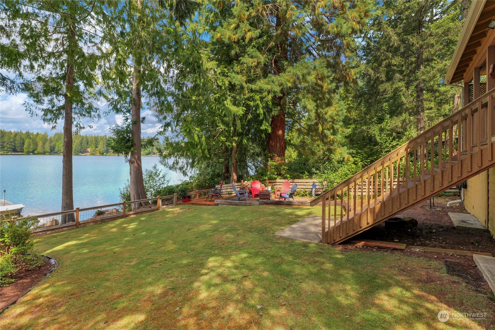 160 East Benson Lake Road Grapeview, WA 98546 - Photo 6 of 34 a view of swimming pool with deck and a yard