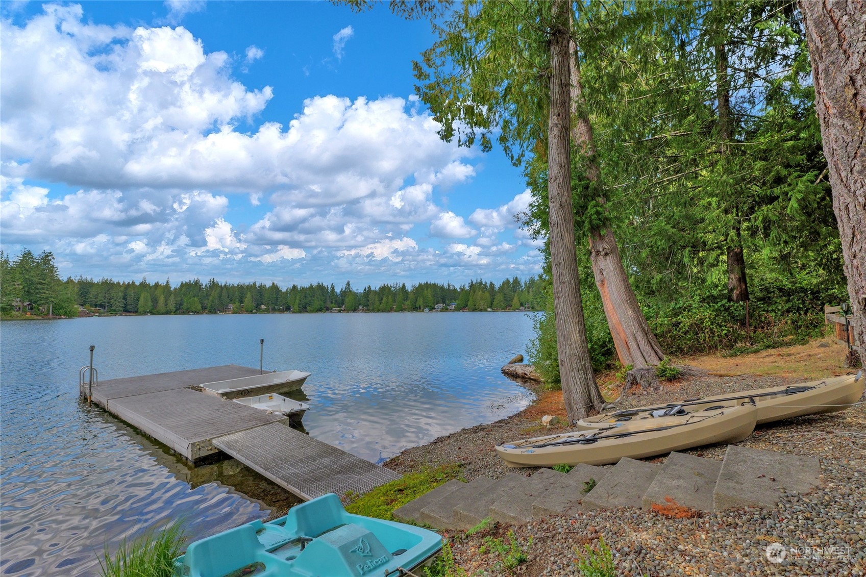 160 East Benson Lake Road Grapeview, WA 98546 - Photo 8 of 34 a view of a lake with a floor to ceiling window
