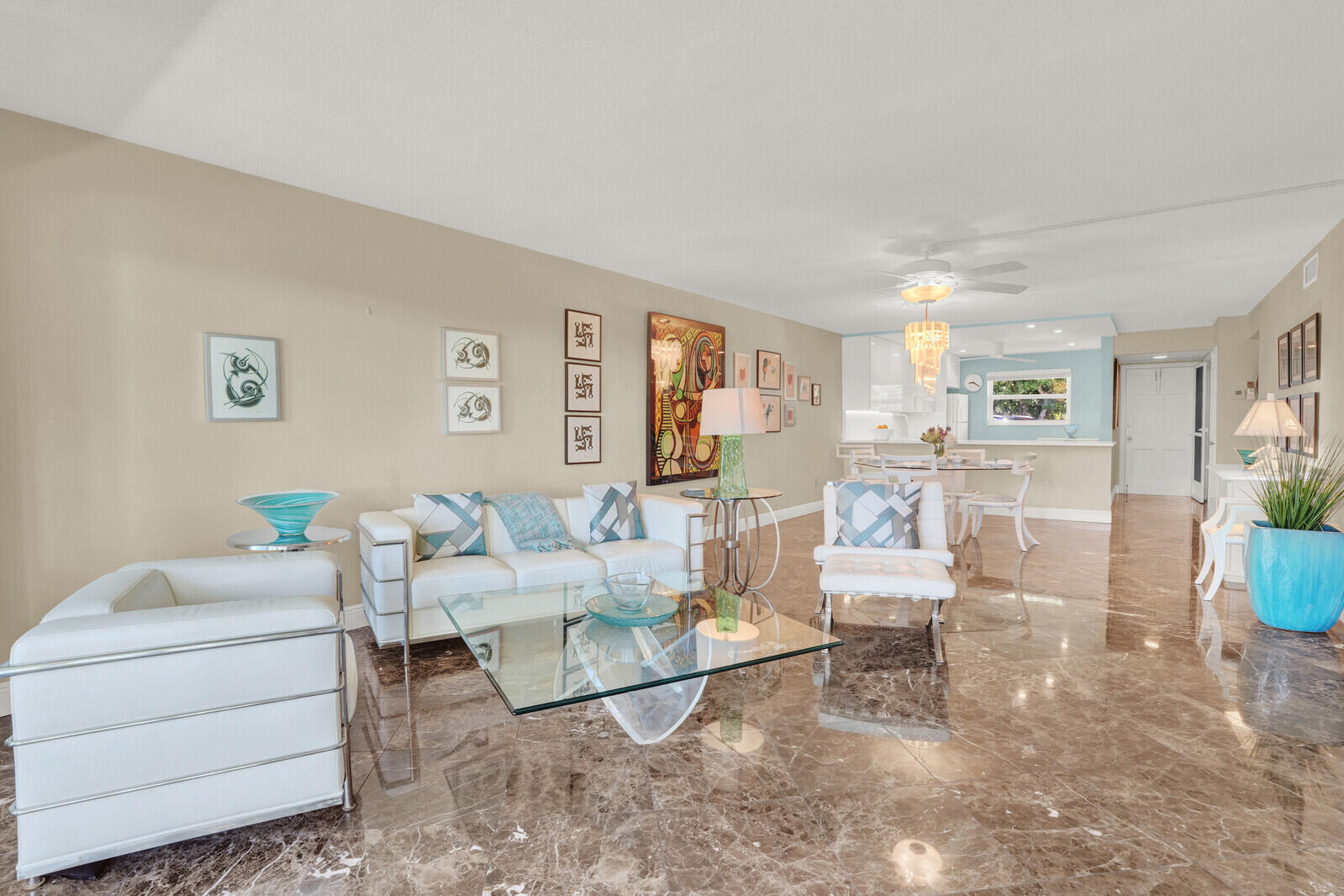 80 Celestial Way, Unit 109 Juno Beach, FL 33408 - Photo 13 of 40 a living room with furniture and a table