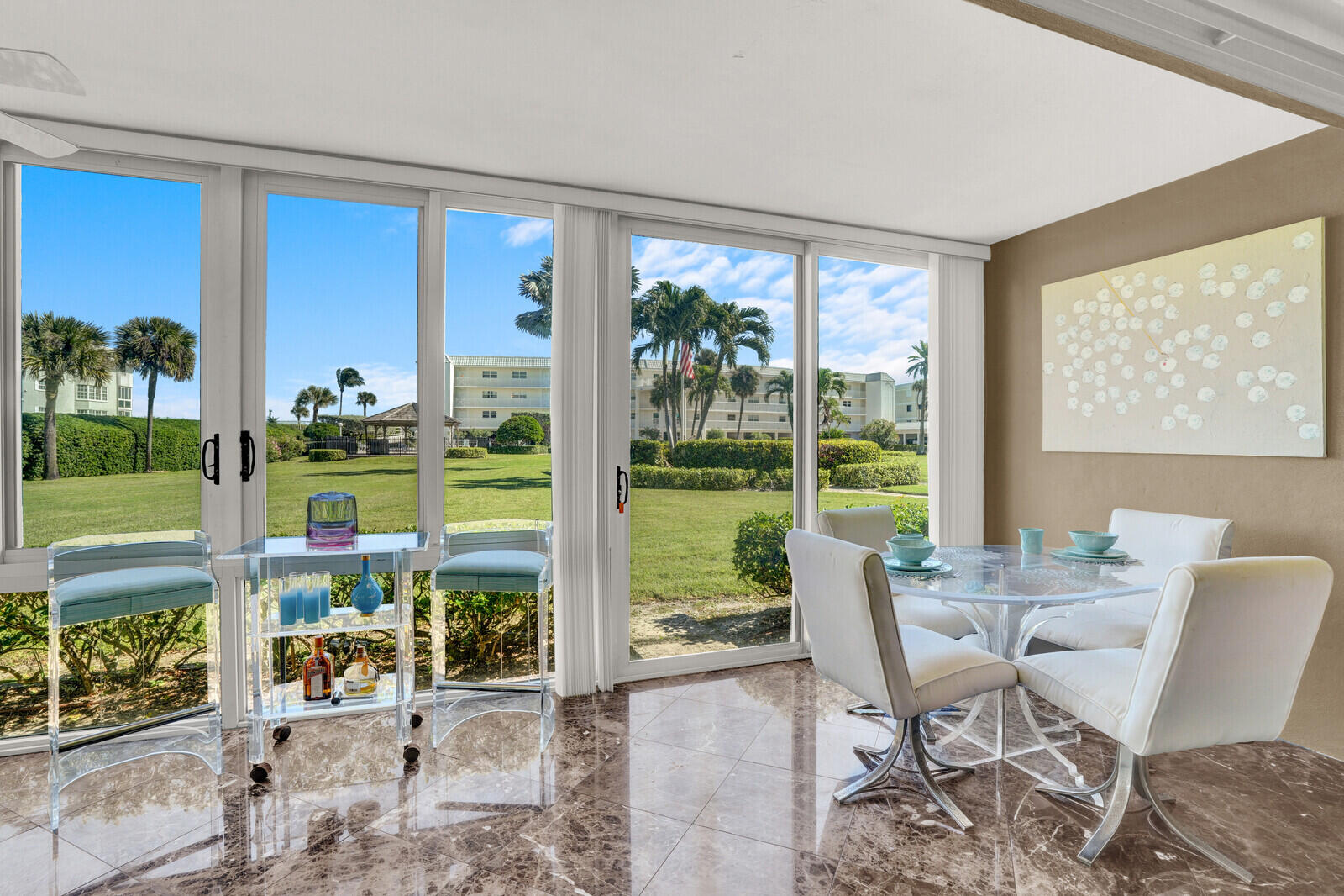 80 Celestial Way, Unit 109 Juno Beach, FL 33408 - Photo 16 of 40 a view of a room with a large window and dining room