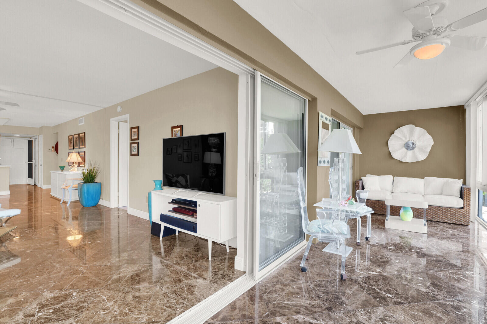 80 Celestial Way, Unit 109 Juno Beach, FL 33408 - Photo 19 of 40 a living room with furniture and a flat screen tv