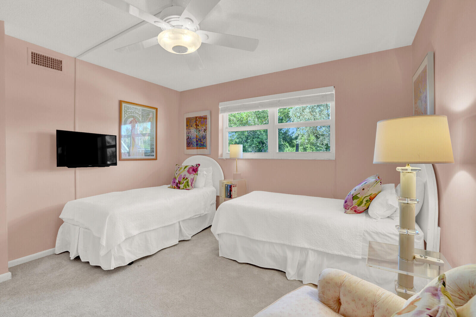 80 Celestial Way, Unit 109 Juno Beach, FL 33408 - Photo 21 of 40 a bedroom with a bed and a lamp