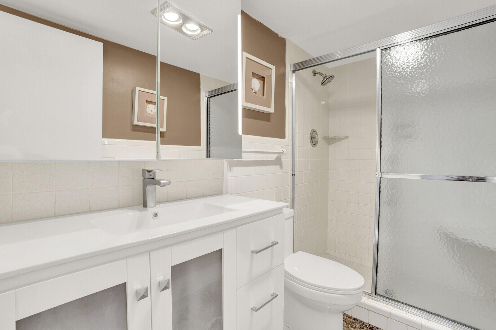 80 Celestial Way, Unit 109 Juno Beach, FL 33408 - Photo 22 of 40 a bathroom with a sink toilet and shower