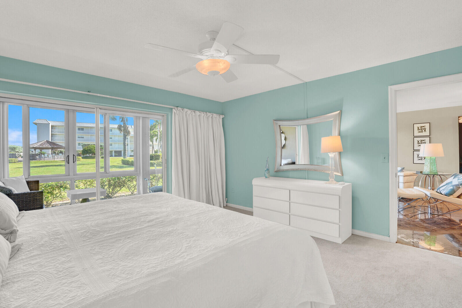 80 Celestial Way, Unit 109 Juno Beach, FL 33408 - Photo 25 of 40 a bedroom with a bed and a large window