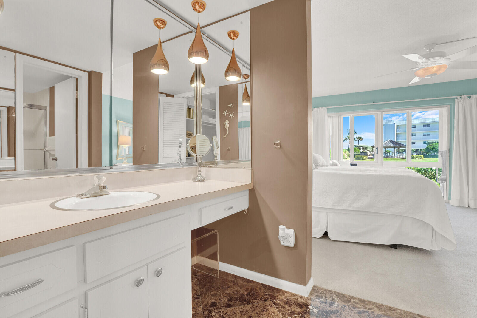 80 Celestial Way, Unit 109 Juno Beach, FL 33408 - Photo 27 of 40 a bathroom with a sink double vanity and a mirror