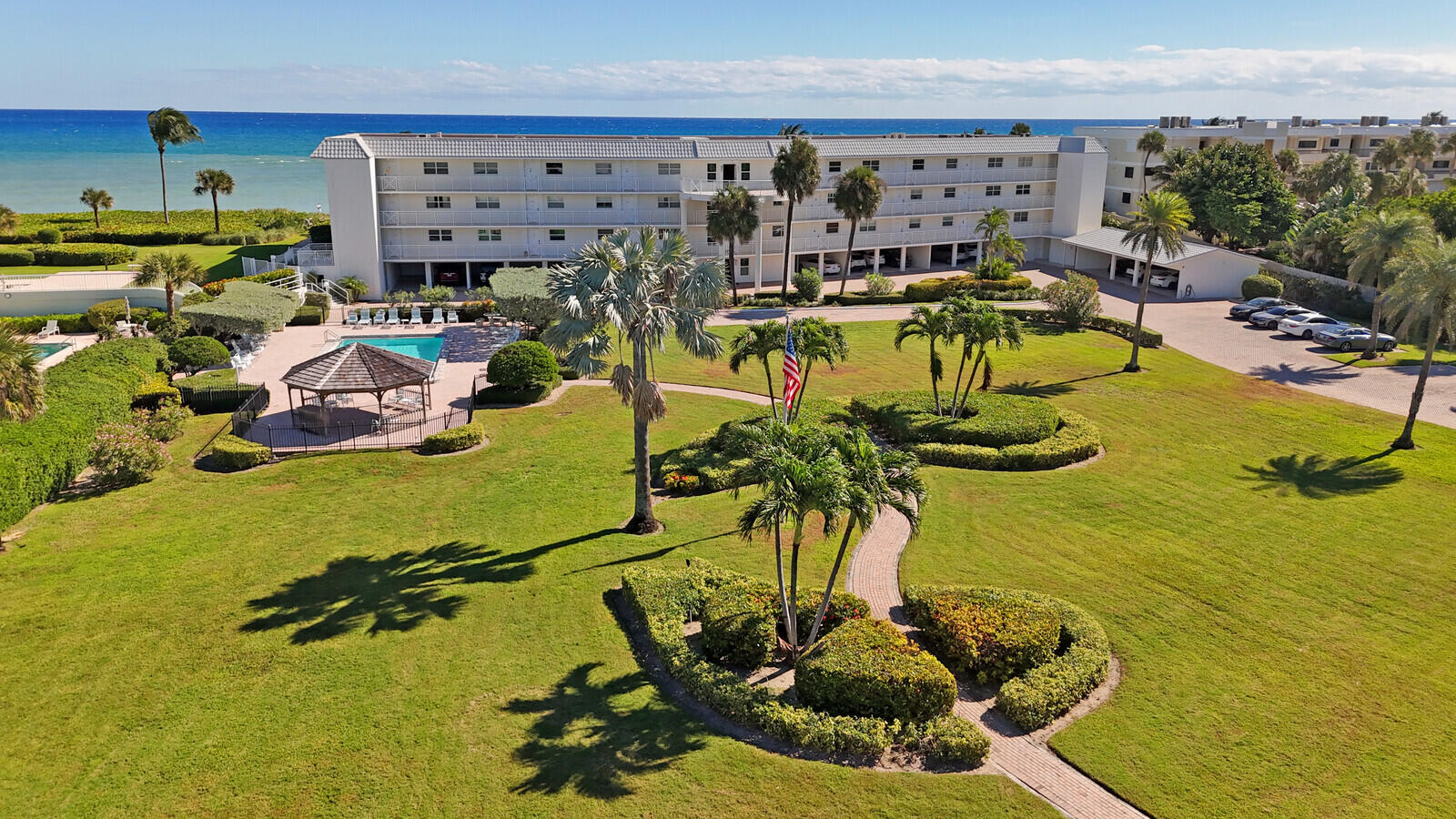80 Celestial Way, Unit 109 Juno Beach, FL 33408 - Photo 33 of 40 a view of a swimming pool with a table and chairs