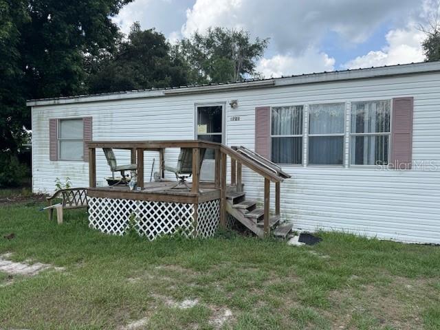 6721 Coronet Road Lakeland, FL 33811 - Photo 2 of 63 a front view of a house with a garden