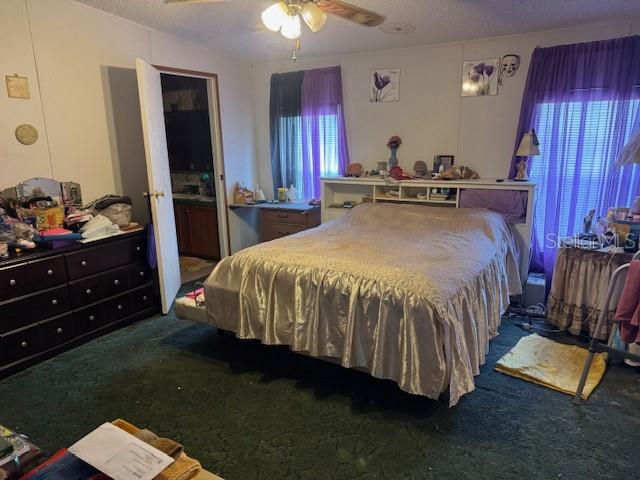 6721 Coronet Road Lakeland, FL 33811 - Photo 24 of 63 a bedroom with a bed and a television