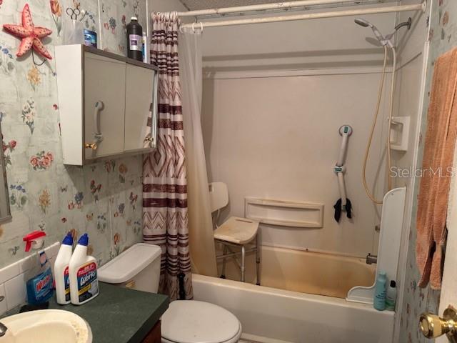 6721 Coronet Road Lakeland, FL 33811 - Photo 34 of 63 a bathroom with a sink toilet and shower