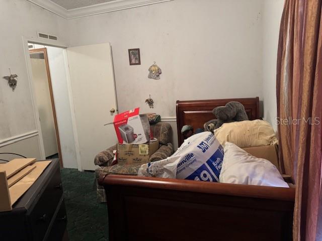 6721 Coronet Road Lakeland, FL 33811 - Photo 36 of 63 a bedroom with a bed and a dresser