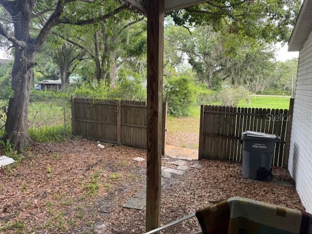 6721 Coronet Road Lakeland, FL 33811 - Photo 40 of 63 a backyard of a house with lots of green space