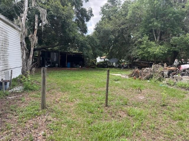 6721 Coronet Road Lakeland, FL 33811 - Photo 44 of 63 a backyard of a house with lots of green space