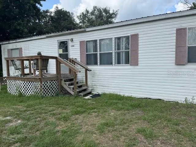 a view of a field with a trees