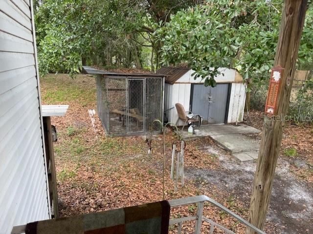 6721 Coronet Road Lakeland, FL 33811 - Photo 47 of 63 a backyard of a house with table and chairs