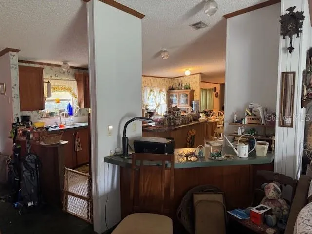 a kitchen with a stove a sink and a cabinets