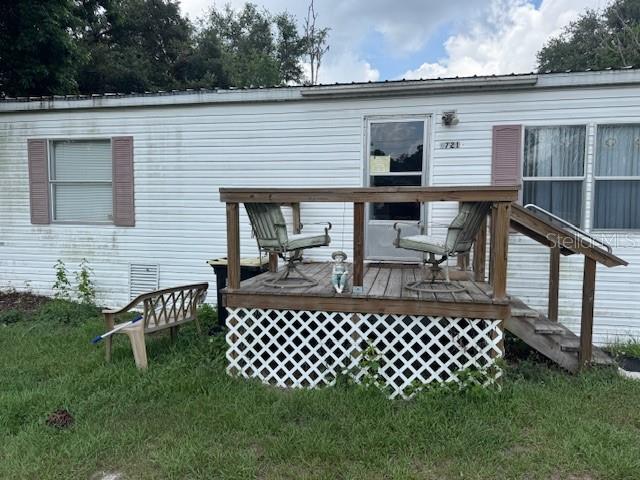 6721 Coronet Road Lakeland, FL 33811 - Photo 62 of 63 a view of a patio with table and chairs