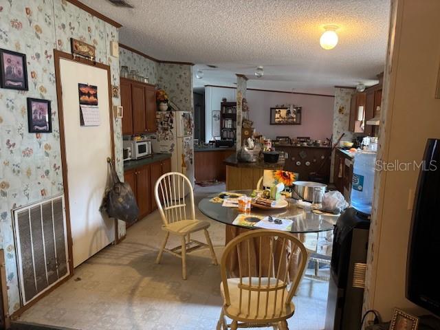 6721 Coronet Road Lakeland, FL 33811 - Photo 10 of 63 a dining room with furniture and chandelier